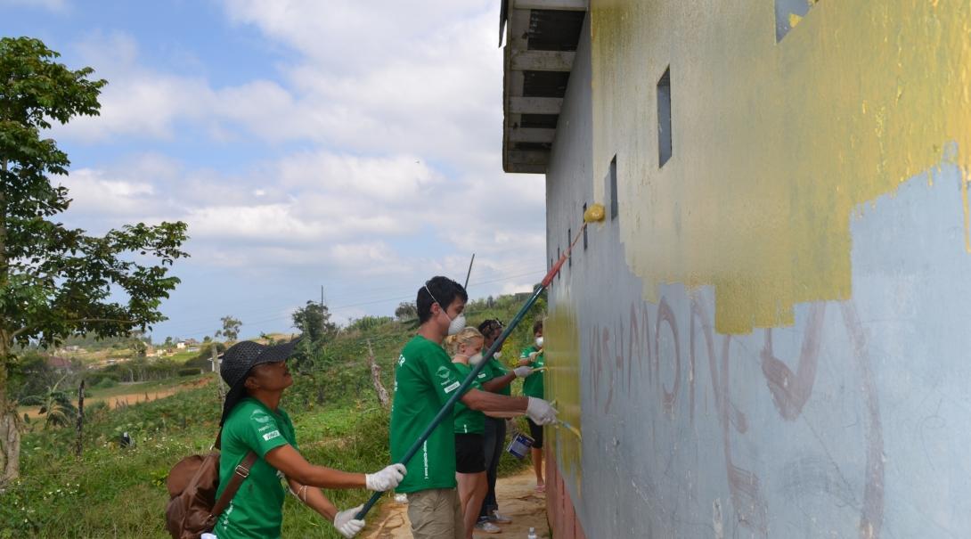 Volunteers from Projects Abroad help to paint a toilet facility as part of their building volunteer work in Jamaica. A group of Projects Abroad volunteers help to paint a toilet facility as part of their buidling volunteer work in Jamaica.
